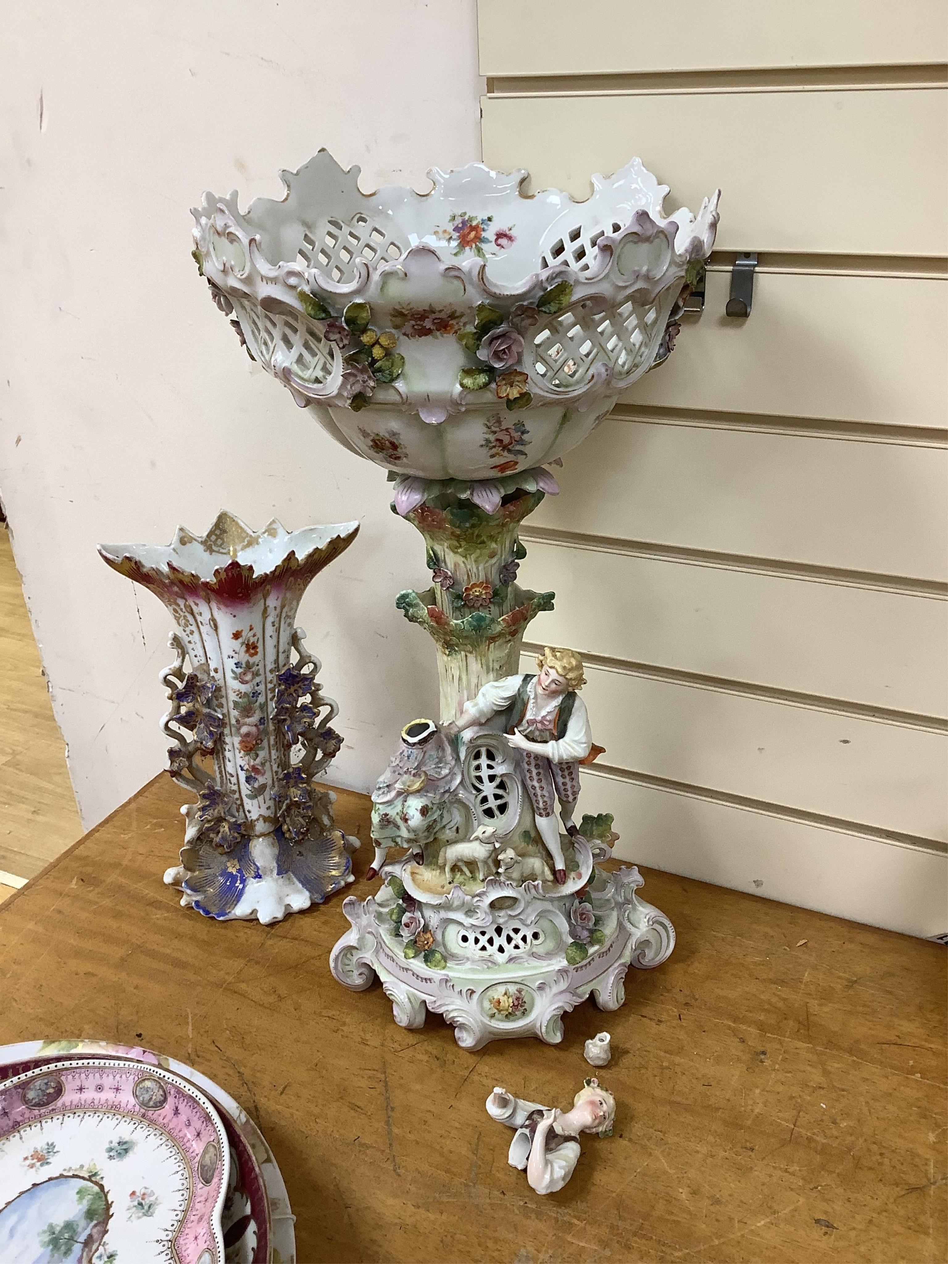 A German porcelain figural centrepiece, lobed dish, three other plates and two others